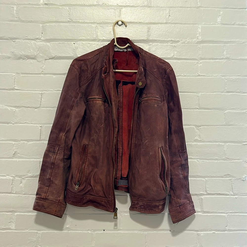 Distressed vintage leather motorcycle jacket